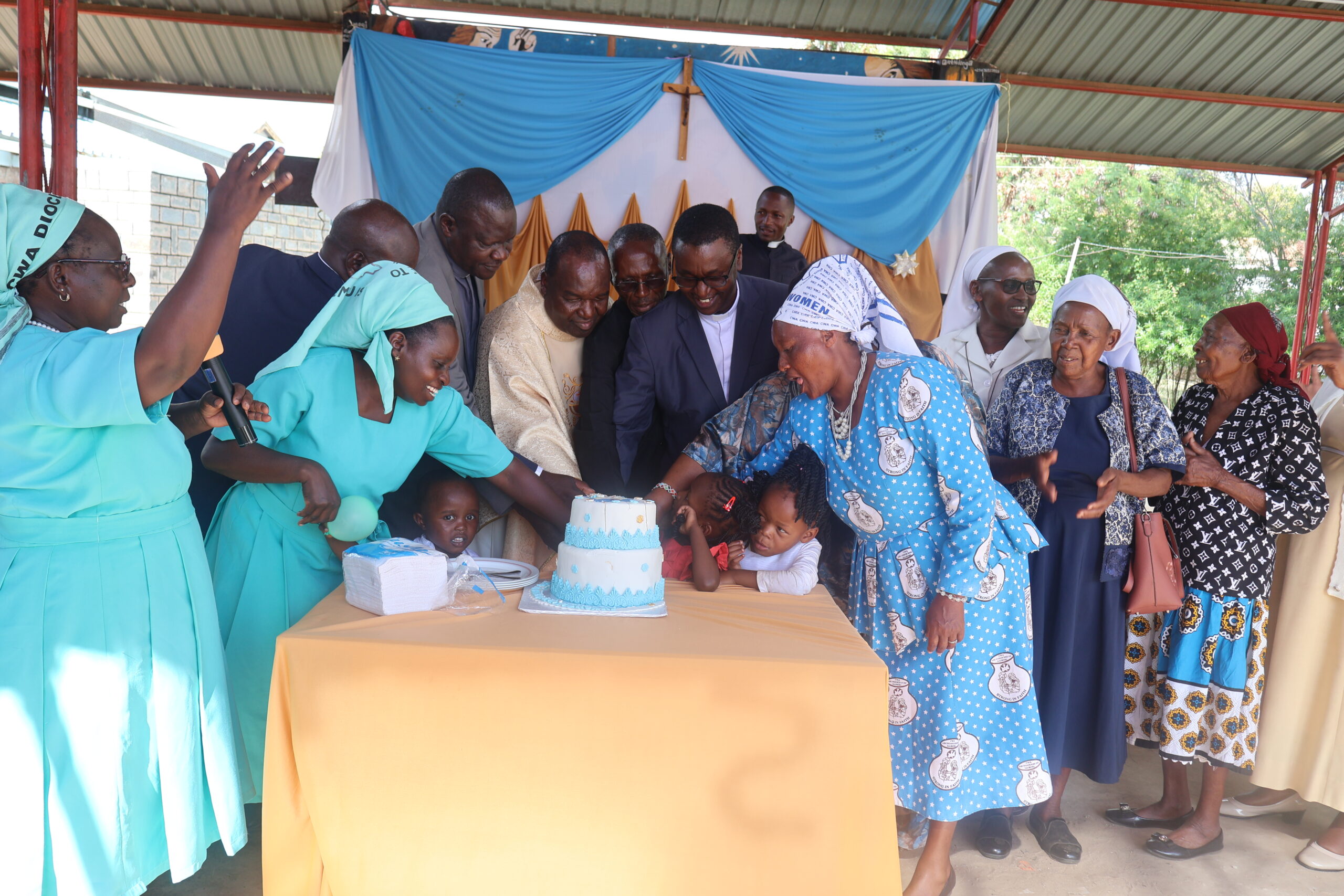 Cake cutting to Mark Diocesan Communications Cordinator, Rev. Fr. James Gatiti (center) priestly silver jubilee celebrations at Maria Consolata Parish on 20th December 2025