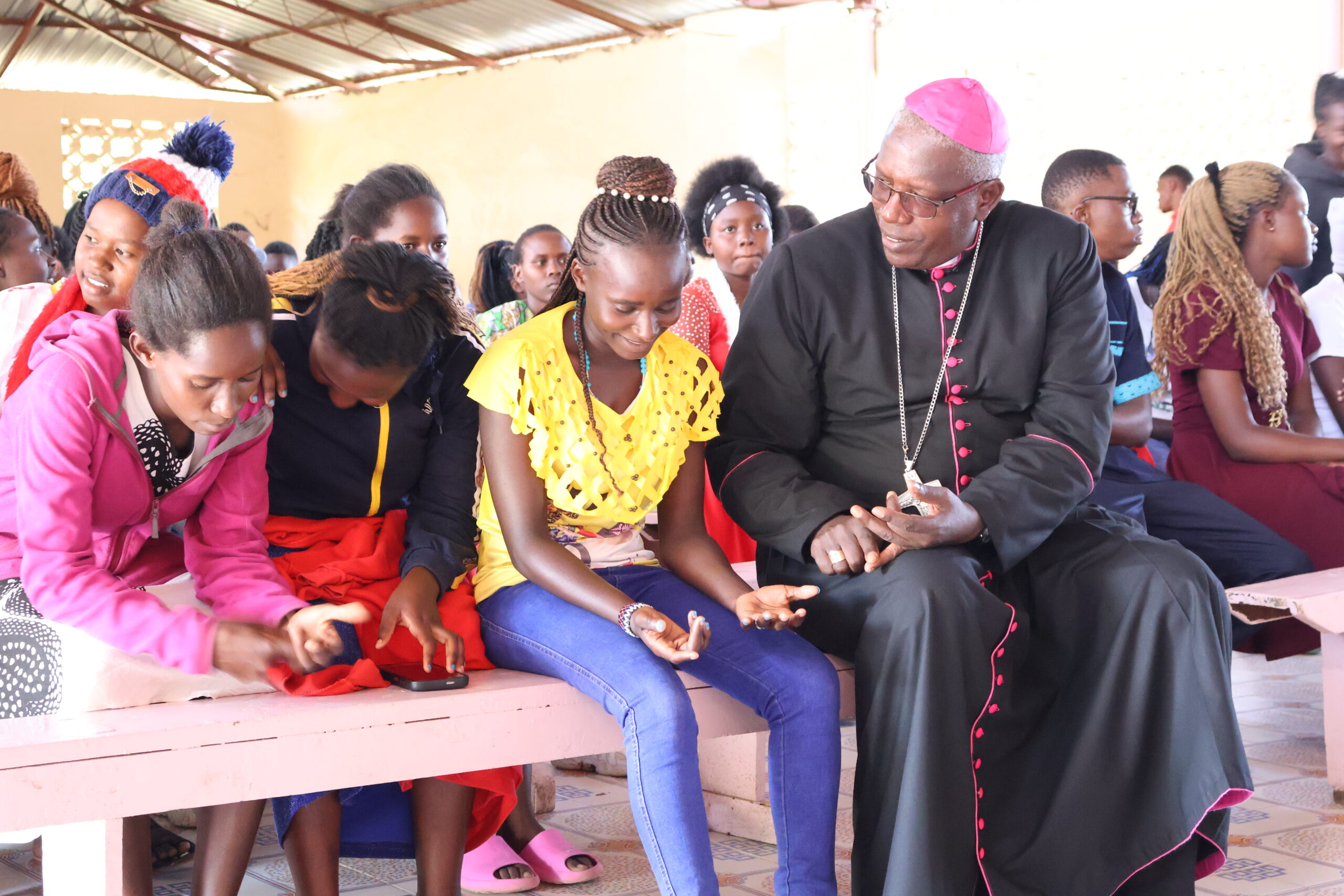 Diocese of Embu Bishop Peter Kimani engaging one on one with youth during at Maria Consolata Iriamurai parish on 18th December 2025 during the parish's Youth Seminar